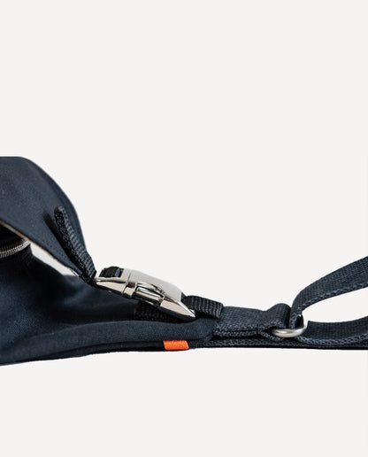 An aluminum side-squeeze buckle secures the front flap of Dock 5’s spacious, hand-sewn Viking Dragon Canvas Sling Bag
