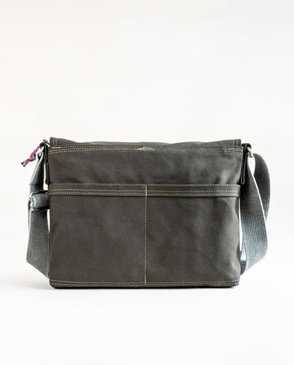 Back exterior pockets of Dock 5’s Lake Superior Canvas Messenger Bag in olive featuring art from owner Natalija Walbridge